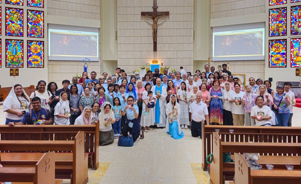 Members of Flame of Love Singapore gathered in the church nave for a group photograph