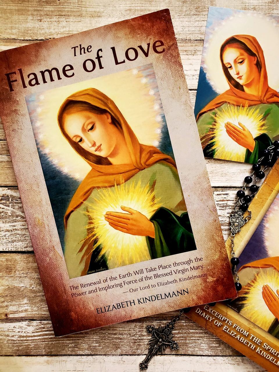 The Spiritual Diary of Elizabeth Kindelmann, English edition, with a rosary laid across the cover
